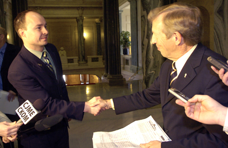 Lee 
Harding presents petitions to Saskatchewan NDP Opposition Leader Lorne 
Calvert
